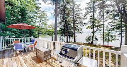 Two-story lakefront home with a seasonal dock, furnished deck, & washer/dryer