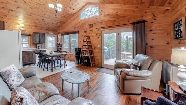 A cabin interior with a dining area, kitchen, and seating area. - Fantastic Lakefront Cabin W/ Free WiFi, Three Kayaks, Private Dock, & Firepit (Winthrop)