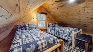 A cabin with two beds, a ceiling fan, and a window. - Fantastic Lakefront Cabin W/ Free WiFi, Three Kayaks, Private Dock, & Firepit (Winthrop)