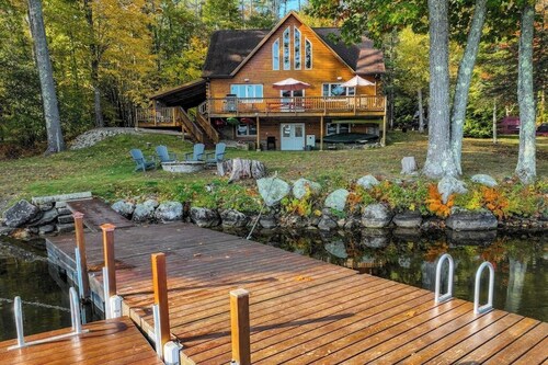 Lakefront, dog-friendly home with dock, kayaks, SUPs, canoe, huge deck & firepit