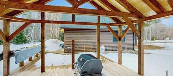 Beautiful log cabin with nearby skiing, large living spaces, and outdoor patio