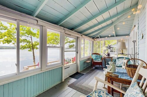 Lakefront dog friendly cottage w/ a dock & beautiful sunset views