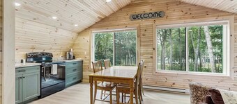 Charming apartment with waterfront access, modern comforts, and lakeside firepit