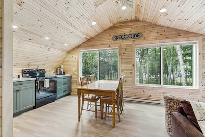 Charming apartment with waterfront access, modern comforts, and lakeside firepit