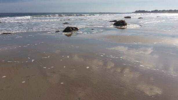 A beach with rocks and waves. - Studio condo with furnished patio, sauna, & pool - near beaches (Wells)