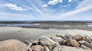 A rocky beach with a clear sky. - Coastal gem on the water with beach access, gorgeous views & spacious layout (Wells)
