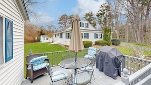 A deck with outdoor furniture, a grill, and a covered umbrella. - Gorgeous dual-unit, perfect for large groups Dogs are welcome (York)