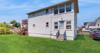 Sun-filled & serene coastal retreat with deck & stunning ocean views - near golf