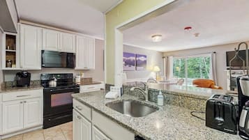 Coffee/tea maker, fridge, microwave, oven