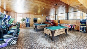A wooden interior with pool tables and arcade machines. - Comfort, convenience & amenities: close to skiing, hiking & shopping (Bartlett)