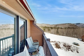 A balcony with a view of snow-covered hills and a clear sky. - Mountain stunner with pools, hot tub, tennis, grilling area, & game tables (Bartlett)