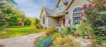 Lovely home with water view, hot tub, fireplace, & washer/dryer