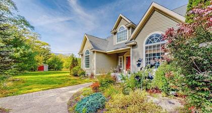 Lovely home with water view, hot tub, fireplace, & washer/dryer