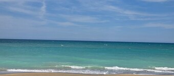 Sunrise Sanctuary only steps to the beach. New AC, 1st floor corner unit.