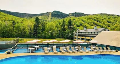 Mountain-view resort condo with access to pools, hot tubs, tennis, & game room