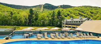 Mountain-view resort condo with access to pools, hot tubs, tennis, & game room