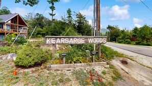 A wooden sign with the text 'KEARSARGE WOODS' indicating a location. - 3-story condo near skiing with Ping-Pong, foosball, fireplace, balcony, & W/D (North Conway)