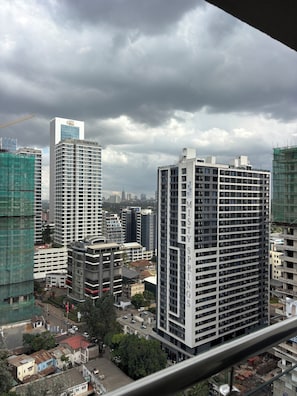 A high-rise building with 'GTC RESIDENCE' and 'MISTY SPRING' signage, surrounded by other buildings and construction sites. - 2-bedroom apartment on 18th floor in adorable Nairobi with fitness room access, (Nairobi)