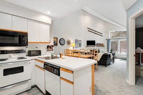 Slopeside condo with nearby skiing, balcony, fireplace, & washer/dryer