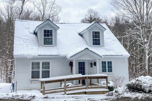 Picturesque creekside home with gorgeous deck & sunroom, near 4 ski mountains