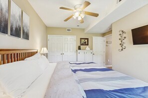 A bedroom with a bed, a ceiling fan, a wardrobe, and a framed photo on the wall. - Ski-In/Ski-Out Condo w/ Pool & Seasonal Hot Tubs - Golf & Tennis Nearby (Ludlow)