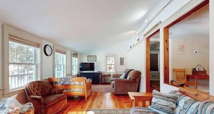 Quaint lakefront home with a fire pit and beautiful views