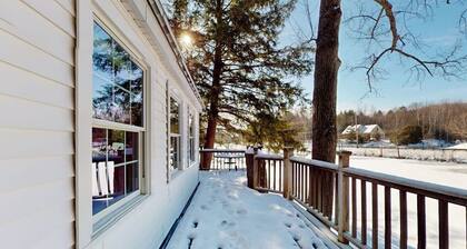 Quaint lakefront home with a fire pit and beautiful views