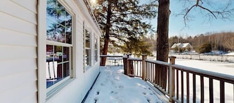 Quaint lakefront home with a fire pit and beautiful views