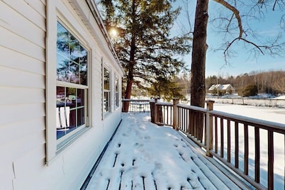 Quaint lakefront home with a fire pit and beautiful views