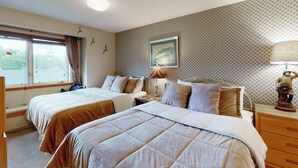 A hotel room with two beds, a window with curtains, a wall-mounted picture, a lamp, and a dresser. - Ski-in/out mountainside condo close to everything with full kitchen - tranquil (Ludlow)