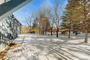 A snow-covered outdoor area with trees and a building. - Skiers apartment, walk to lifts at Sundance Resort, mountain views, shuttle, w/d (Dover)