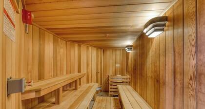 Ski-in/ski-out condo with pool, hot tub, sauna, mountain view, deck, & fireplace