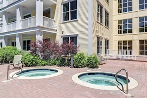 A hotel with two outdoor swimming pools, a covered patio area, and a landscaped garden. - Mountain Home w/Balcony, Pool Views, Shared Pool, Hot Tub, Free WiFi, Fireplace (Stratton)