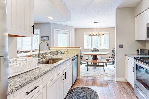 Mountain-view condo with private balcony, fireplace, & updated interior