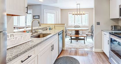 Mountain-view condo with private balcony, fireplace, & updated interior