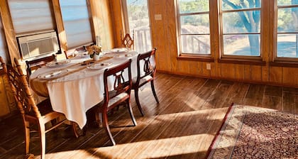 A spacious vintage cabin with 6 bedrooms and 2.5 bathrooms.