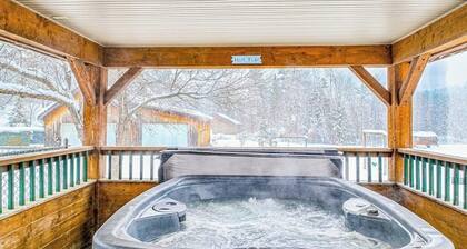 Dog-friendly, mountain-view cabin with shared hot tub, fireplace, & central AC