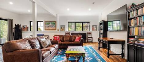 TV, fireplace, books