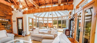 Beautiful, rustic home w/ on-site playground, deck, patio, grill, and fireplace