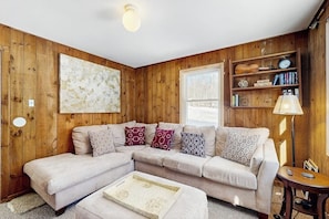 TV, fireplace, books - Cozy, updated riverfront home with gas stove & AC (Warren)