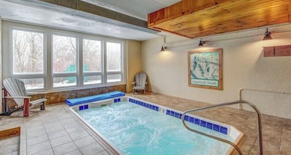 Ski-in/out condo with pool, hot tub, game room, mountain view, & fireplace