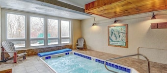 Ski-in/out condo with pool, hot tub, game room, mountain view, & fireplace