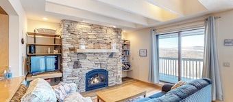 Picturesque mountain view condo with fireplace, balcony, deck, pool, & kitchen