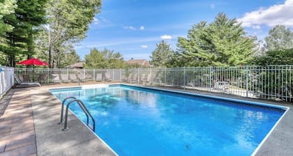 Picturesque mountain view condo with fireplace, balcony, deck, pool, & kitchen