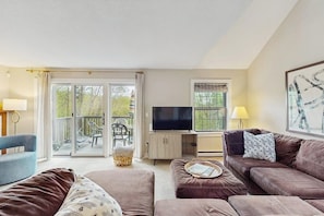 TV, fireplace - Inviting three-story condo with decks  - near the Quechee Club (White River Junction)