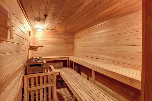 A wooden sauna with benches and a bench seat, a wooden bench, and a small wooden structure. - Top-Floor Condo w/ view of Killington ski slopes, shared pool, hot tub, sauna (Killington)