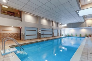 An indoor swimming pool with a tiled floor, a metal ladder, and a ceiling with recessed lighting. - Top-Floor Condo w/ view of Killington ski slopes, shared pool, hot tub, sauna (Killington)