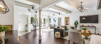 Stunning lakehouse lodge with a deck, fireplace, lush patio & lake access