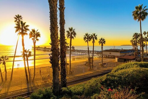 Sunny condo with gorgeous ocean & pier views & covered parking - walk to beach