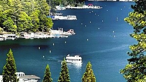 A marina with boats docked, surrounded by trees. - Incredible Lake View, Private Hot Tub, Huge Game Room, A/C,-Short Walk to Lake (Lake Arrowhead)